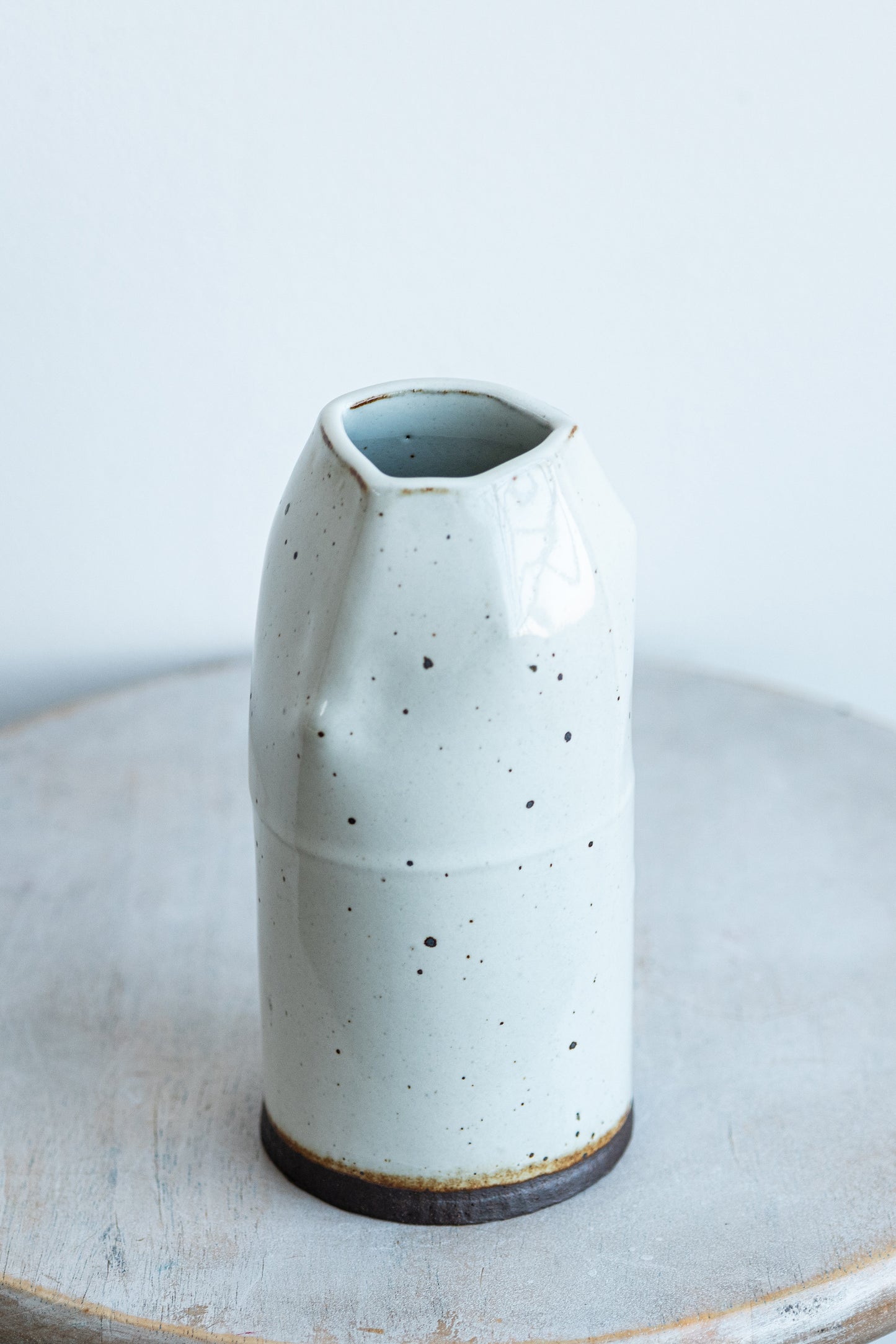 underdog small white stoneware dino vase