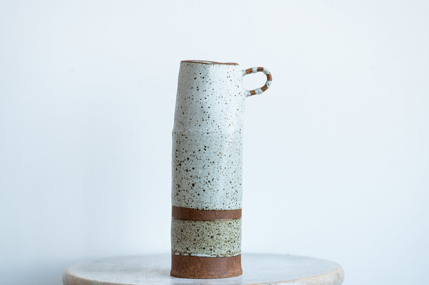 underdog tall stoneware vase with striped handle