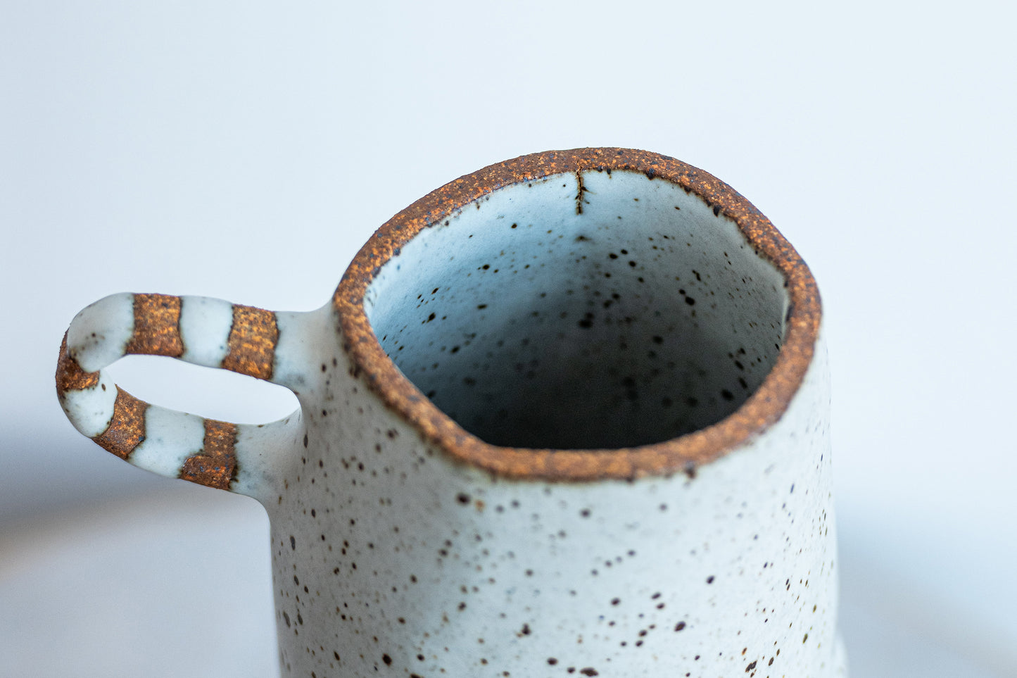 underdog tall stoneware vase with striped handle