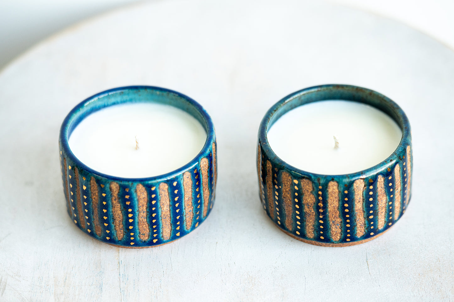 gold speckled blue stoneware candles