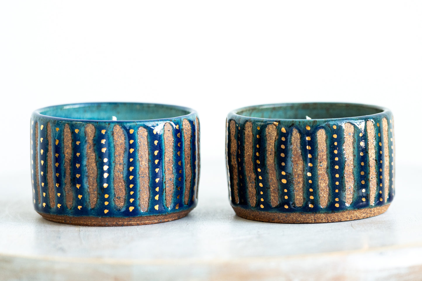 gold speckled blue stoneware candles