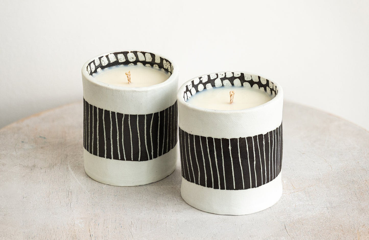 black striped exterior with white blocked interior porcelain candle