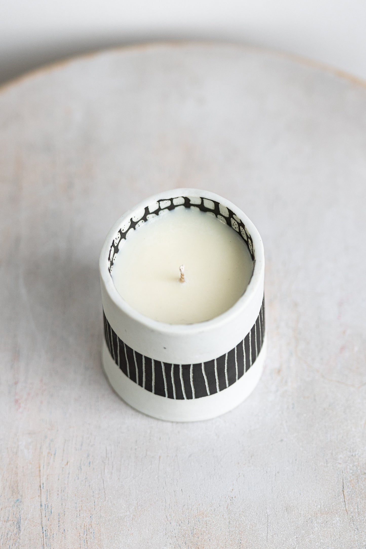 black striped exterior with white blocked interior underdog porcelain candle
