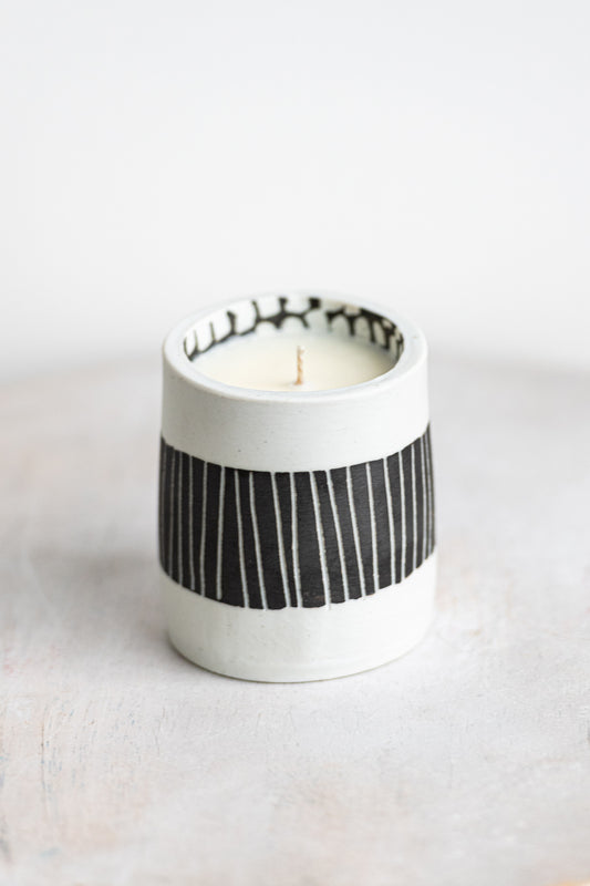 black striped exterior with white blocked interior underdog porcelain candle